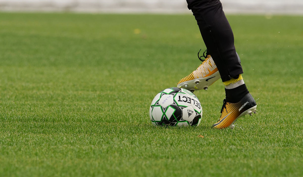Soccer player in action, First Round Management soccer division