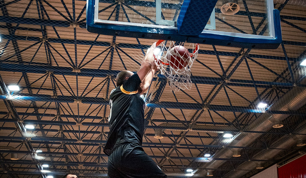 Basketball player in action, First Round Management basketball division