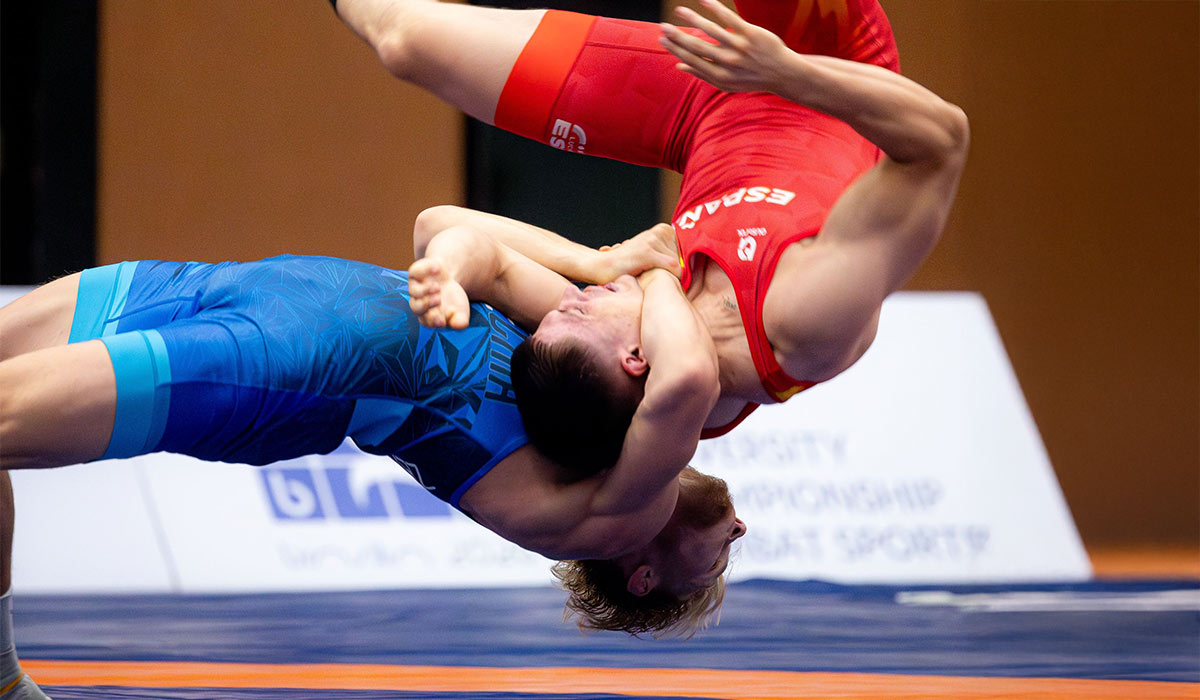 Wrestler in competition, First Round Management wrestling division